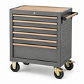 Carrello portautensili in acciaio grigio con piano in legno e sette cassetti